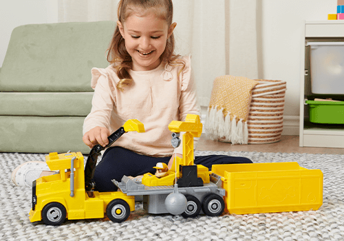 An image of a child playing with the Rubble 2-in-1 X-Treme Truck